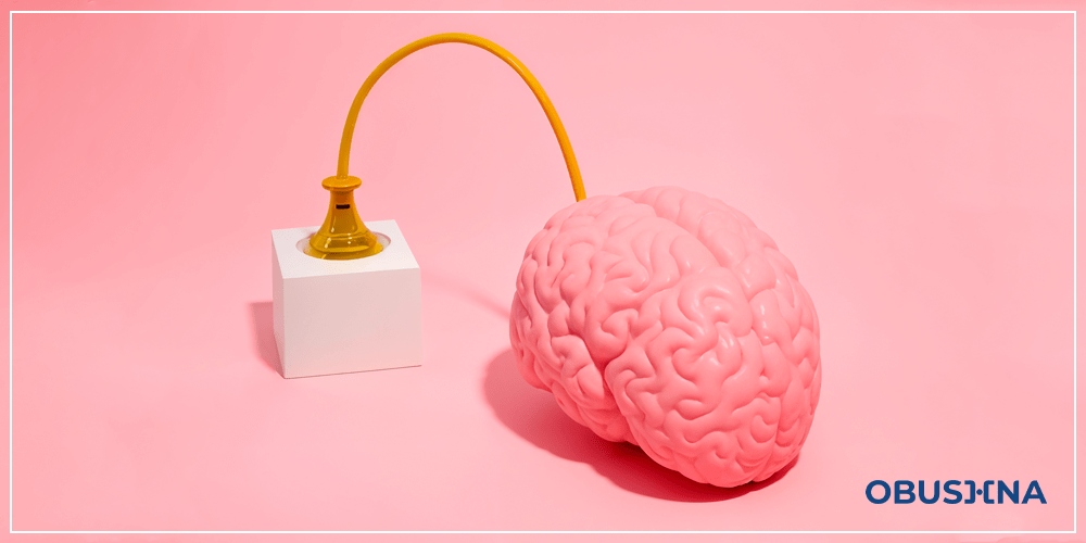 Мозок, що заряджається через розетку, символізуючи дофаміновий вплив